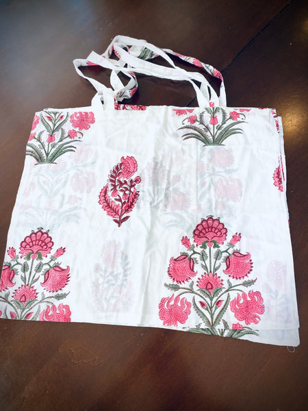 Reusable grocery bags foldable. White and pink floral print.