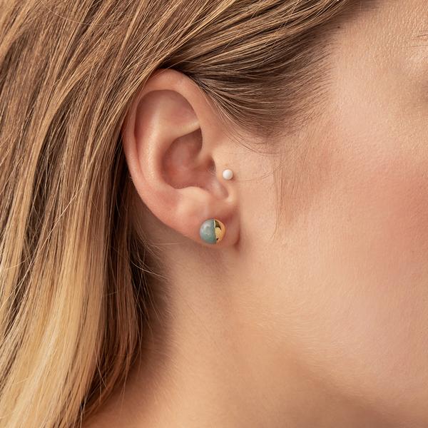 Stone studs dipped in 14k gold on model.