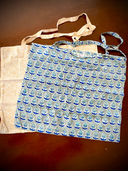 Reusable grocery bags foldable. Yellow wave pattern and gray and blue floral pattern.
