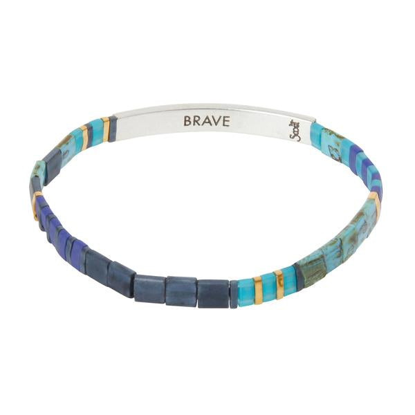 Silver and cobalt glass bead miyuki bracelet with silver bar with "Brave" stamped on inside.
