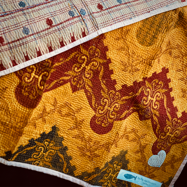 Beautiful kantha personal quilt in reds and golds to add color to your home.