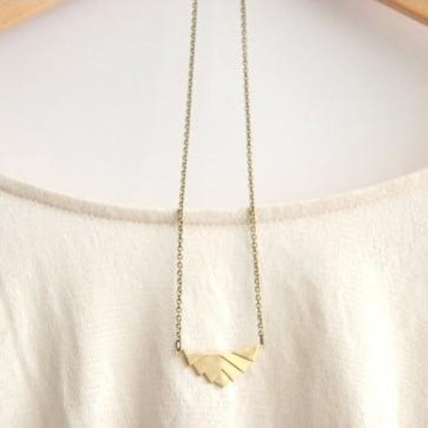 Art deco necklace gold on chain.