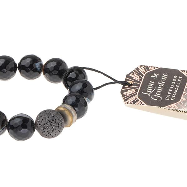 Essential oils diffuser bracelet close up of black agate and lava diffuser bead.