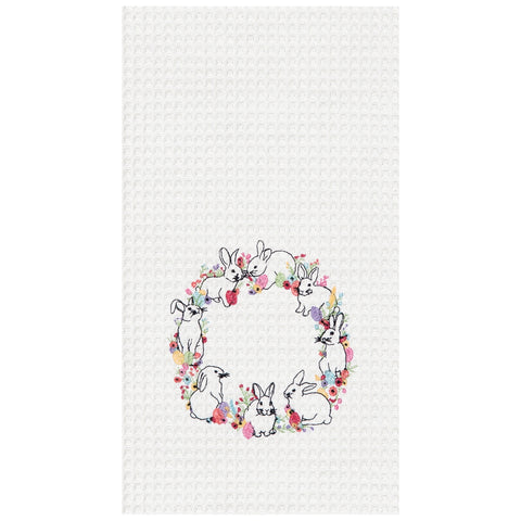 Easter decor for home. White waffle weave towel with embroidered wreath of flowers and bunnies.