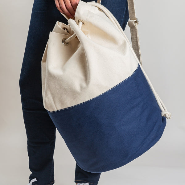 Canvas laundry tote bag. Navy and natural is easy to carry.