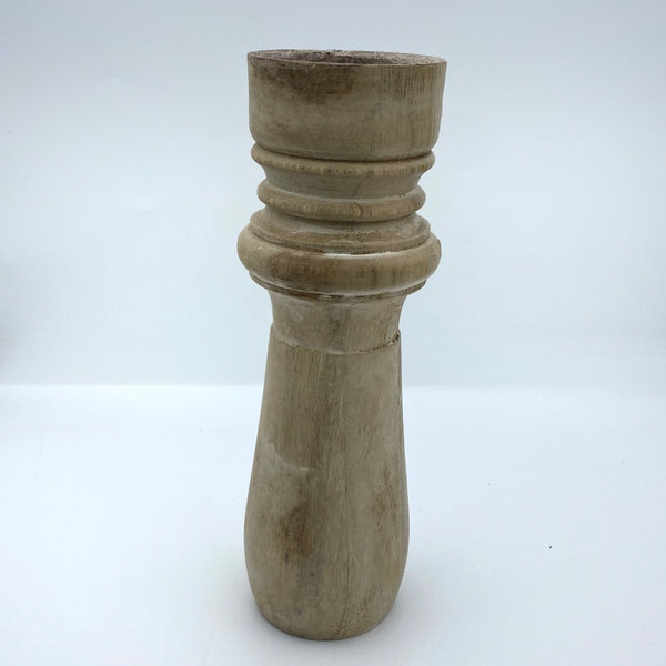 Pillar candle holder tall in tapered shape.