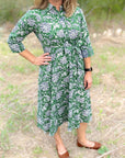 Green dahlia floral cotton day dress.