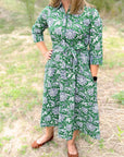 Green dahlia floral cotton day dress with optional waist sash.