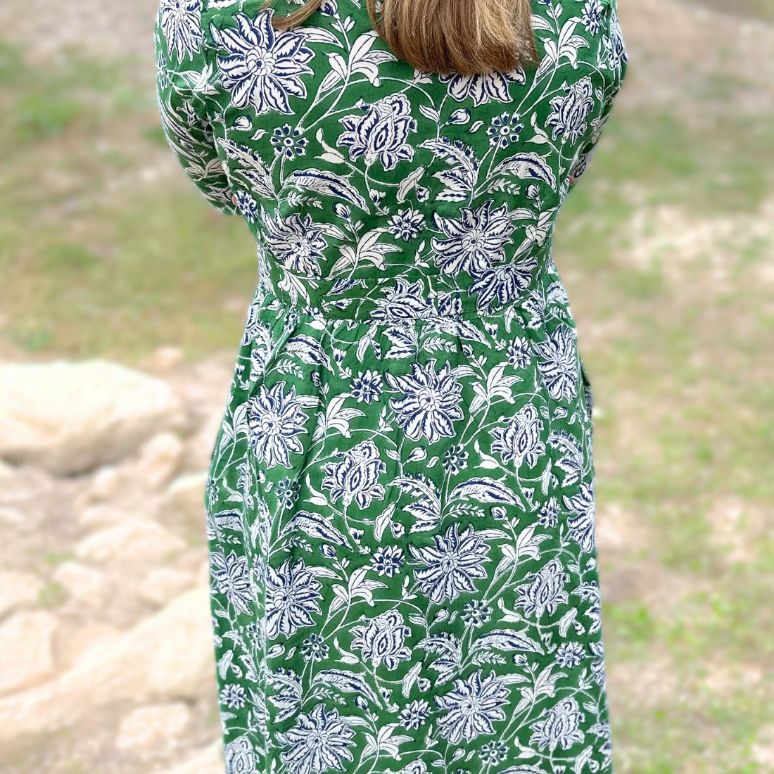 Green dahlia floral cotton day dress back view.