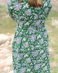 Green dahlia floral cotton day dress back view.