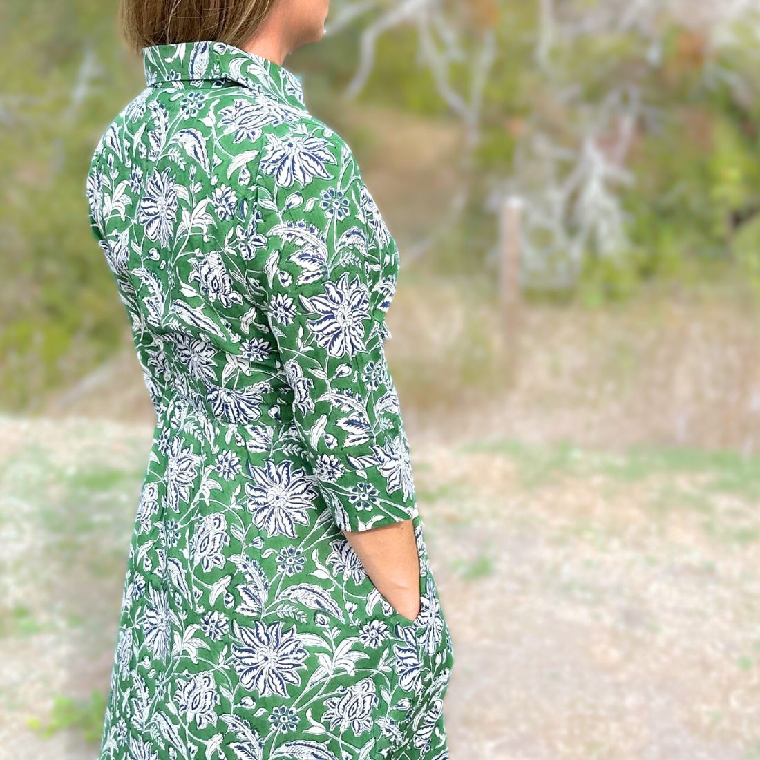 Green dahlia floral cotton day dress with pockets.