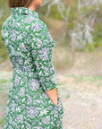 Green dahlia floral cotton day dress with pockets.