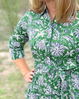 Green dahlia floral cotton day dress close up of front.