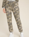 Drawstring women's camo jogger pants with loose fit.