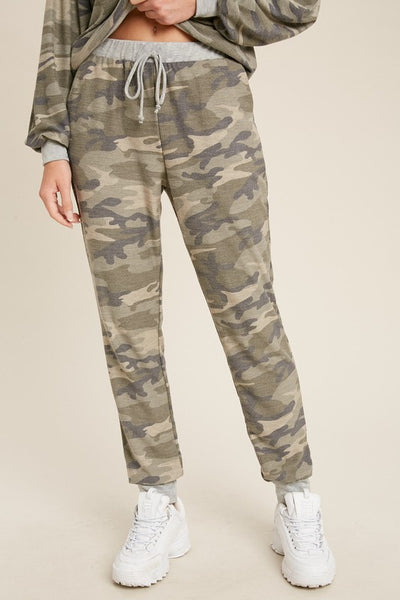 Drawstring women's camo jogger pants with loose fit.