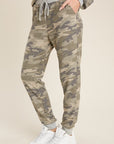 Women's lightweight camo jogger pants with grey cuffs and drawstring waist. Pockets.