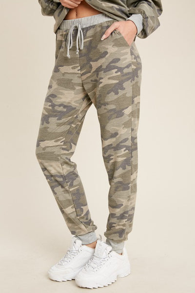 Women's lightweight camo jogger pants with grey cuffs and drawstring waist. Pockets.