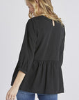 Back view of Women's embroidered peasant top. - Black with half sleeves and peplum cut.