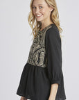 Side view of Women's embroidered peasant top. - Black with half sleeves and peplum cut.