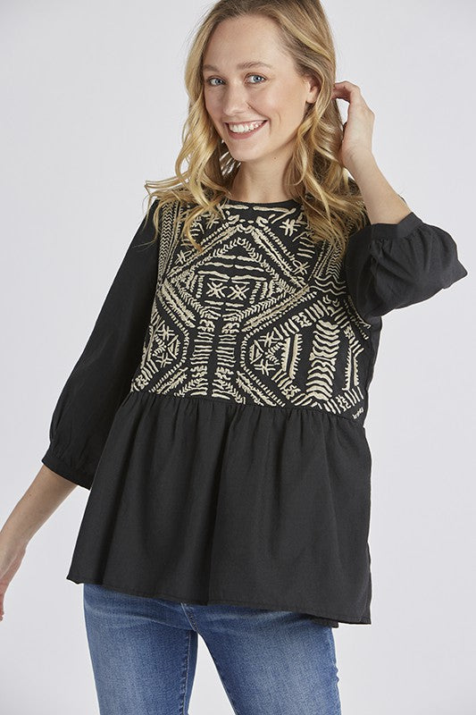 Women's embroidered peasant top. - Black with half sleeves and peplum cut.