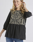 Women's embroidered peasant top. - Black with half sleeves and peplum cut.