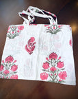 Reusable grocery bags foldable. White and pink floral print.