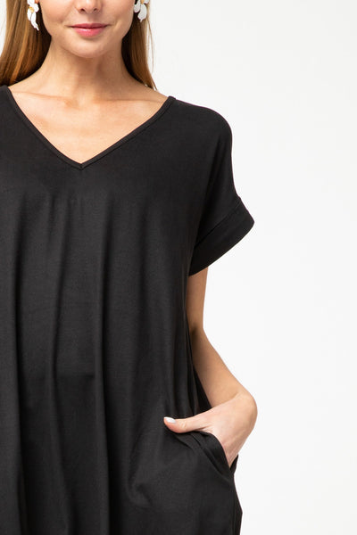 Close up of black knit maxi v-neck and rolled short sleeves.