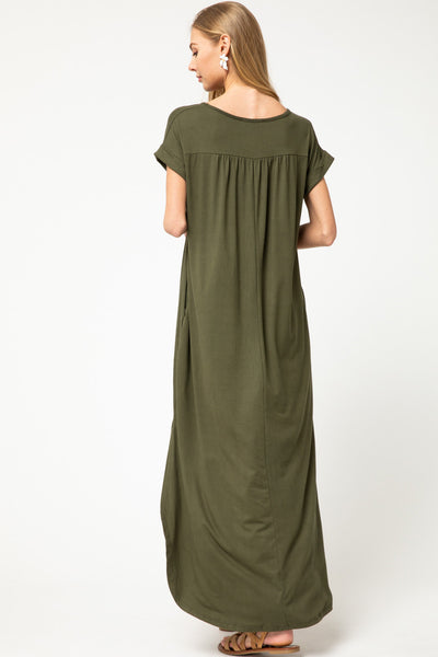 Back view of olive colored maxi with pleating at back yoke.