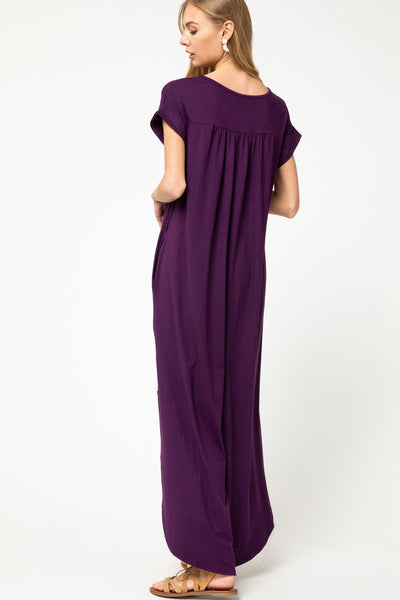 Back view of plum maxi with pleating at back yoke.