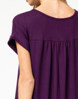 Close up of plum maxi pleated yoke.