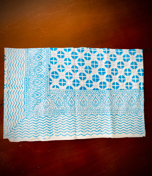Unique sarongs. Turquoise and white print.