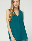 Women's tops on sale. V-neck sleeveless blouse in teal.