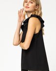 Side view of ruffle sleeve top in black with good length for longer torsos.