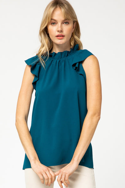 Ruffle neck and sleeve blouse in teal.