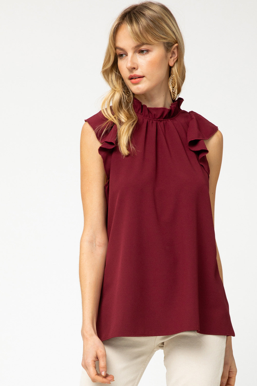 Women&#39;s tops and blouses with ruffle mock neck and ruffle sleeve in burgundy.