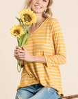 V-neck 3/4 sleeve tunic in goldenrod "mustard" color with white stripes.