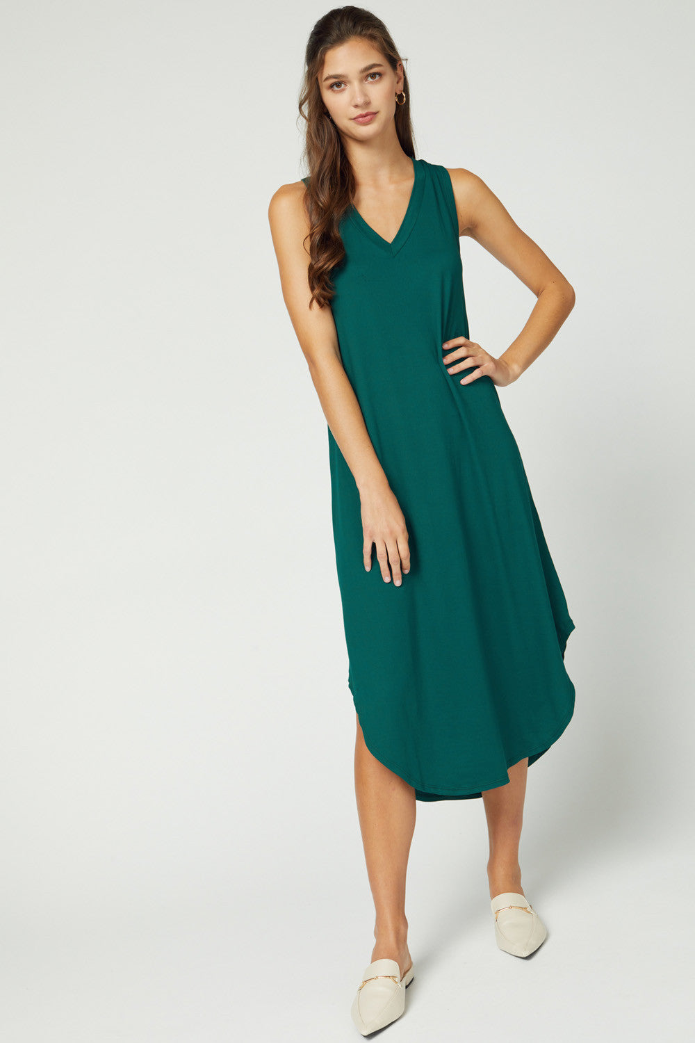 Full length view of sleeveless v-neck midi in hunter green.