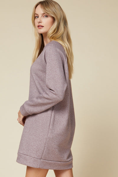 Side view of heathered sweater dress with banding at hem and long sleeve cuffs.