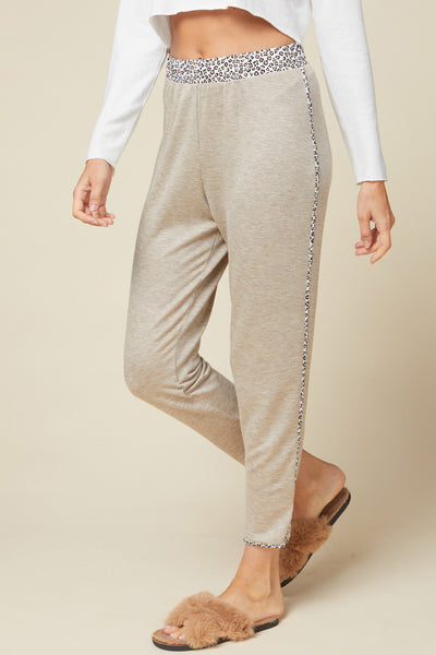 High waisted loungewear joggers in oatmeal color with leopard trim and elastic waist.