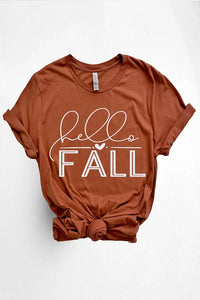 Women's Graphic Tees Vintage Look - "HELLO FALL" in burnt orange shirt with white font.