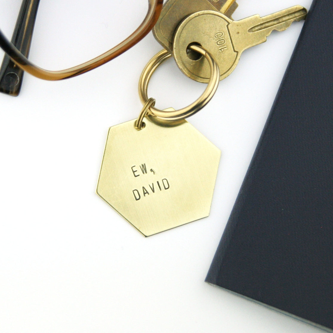 "Ew, David" gift hexagon shaped brass keychain.