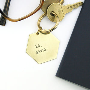 "Ew, David" gift hexagon shaped brass keychain.