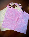 Reusable grocery bags foldable. Yellow and pink wave pattern.