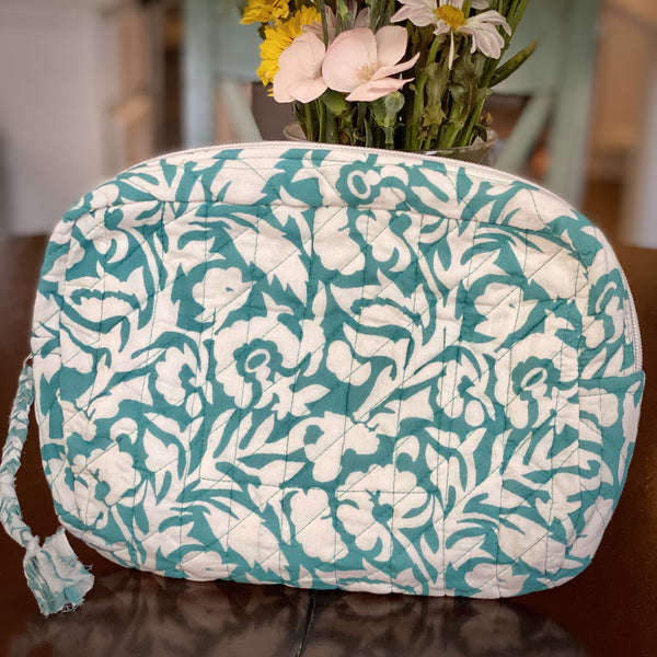 Aqua and white patterned cotton travel pouch.