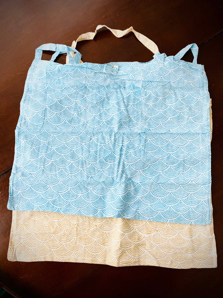 Reusable grocery bags foldable. Aqua and yellow wave patterns.