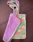 Kantha stitch bags. Reverse side of pink bag with pink and green floral pattern.