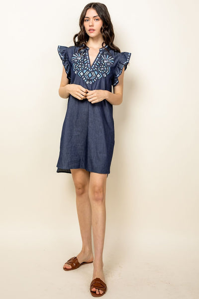 Woman's embroidered denim dress. Chambray with ruffle sleeves.
