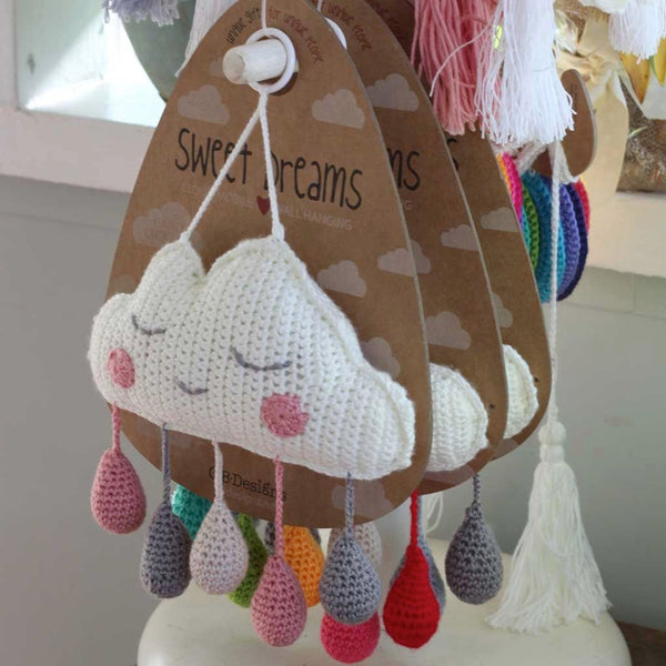 Unique baby gifts.  Cloud mobiles on display in store.