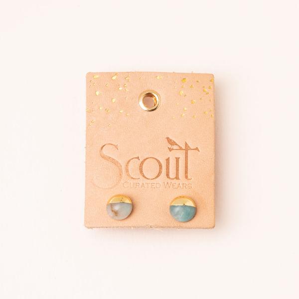 Stone stud dipped in 14k gold on leather display card.