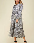 Beautiful snake skin print in greys on long sleeve button bodice tiered skirt maxi dress.